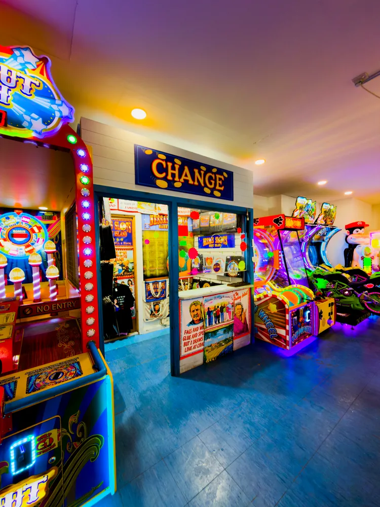 the arcade provides the bright machines; use with a barry waterfront frame such as img_8930 in the same carousel, rather than implying water is visible in this arcade image.